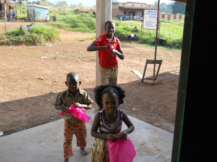 neighbor kids having fun with pink bubble wrap on my porch